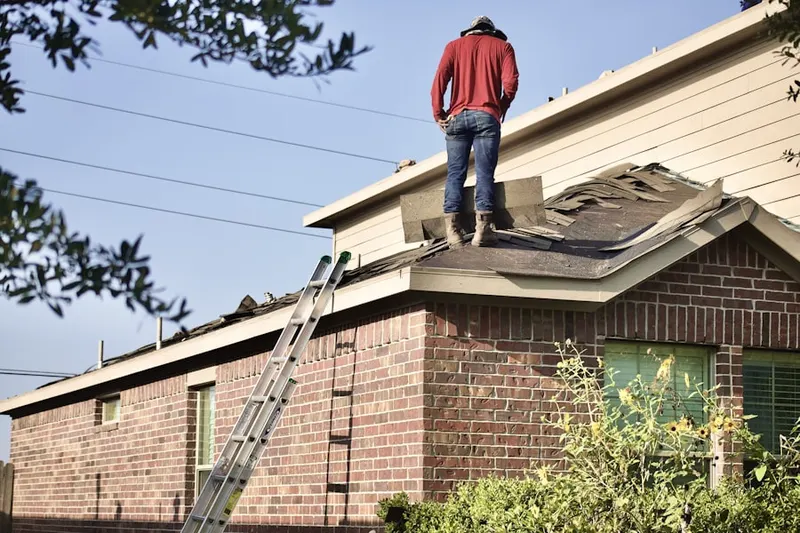 Professional roofer working on a residential roof in Diamond View